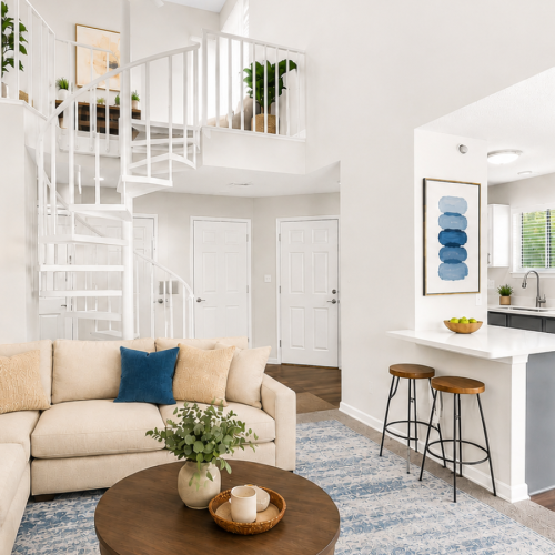 Living room with a staircase and a couch