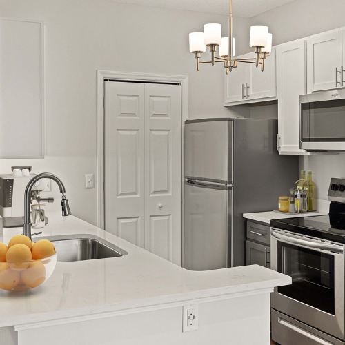Beautiful kitchens with designer finishes a kitchen with white countertops