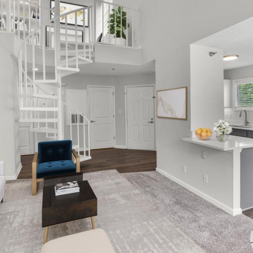Gorgeous living areas to entertain and enjoy a living room with a staircase and a couch